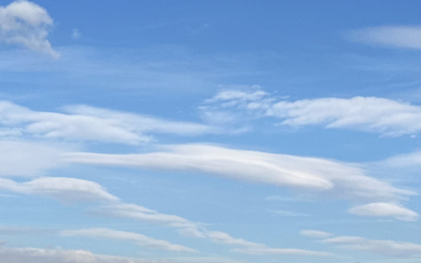 thin flat clouds in a pale blue sky